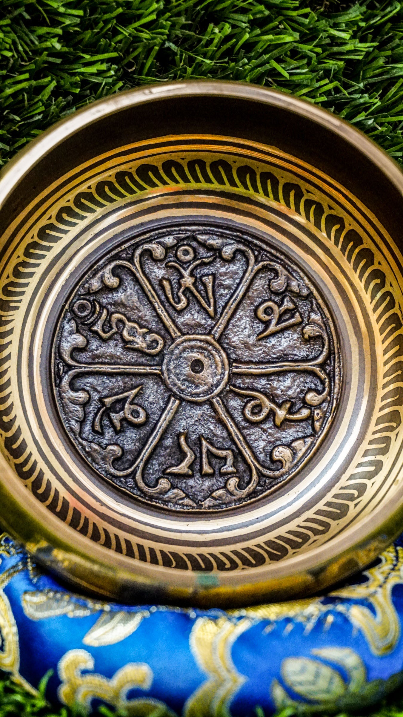 
This singing bowl has the Om Mani Padme Hum mantra carved inside on a mandala and around the outside. Its clear, steady tone supports meditation and calm. Comes with a wooden mallet and silk cushion. Wipe gently and store in a dry place.