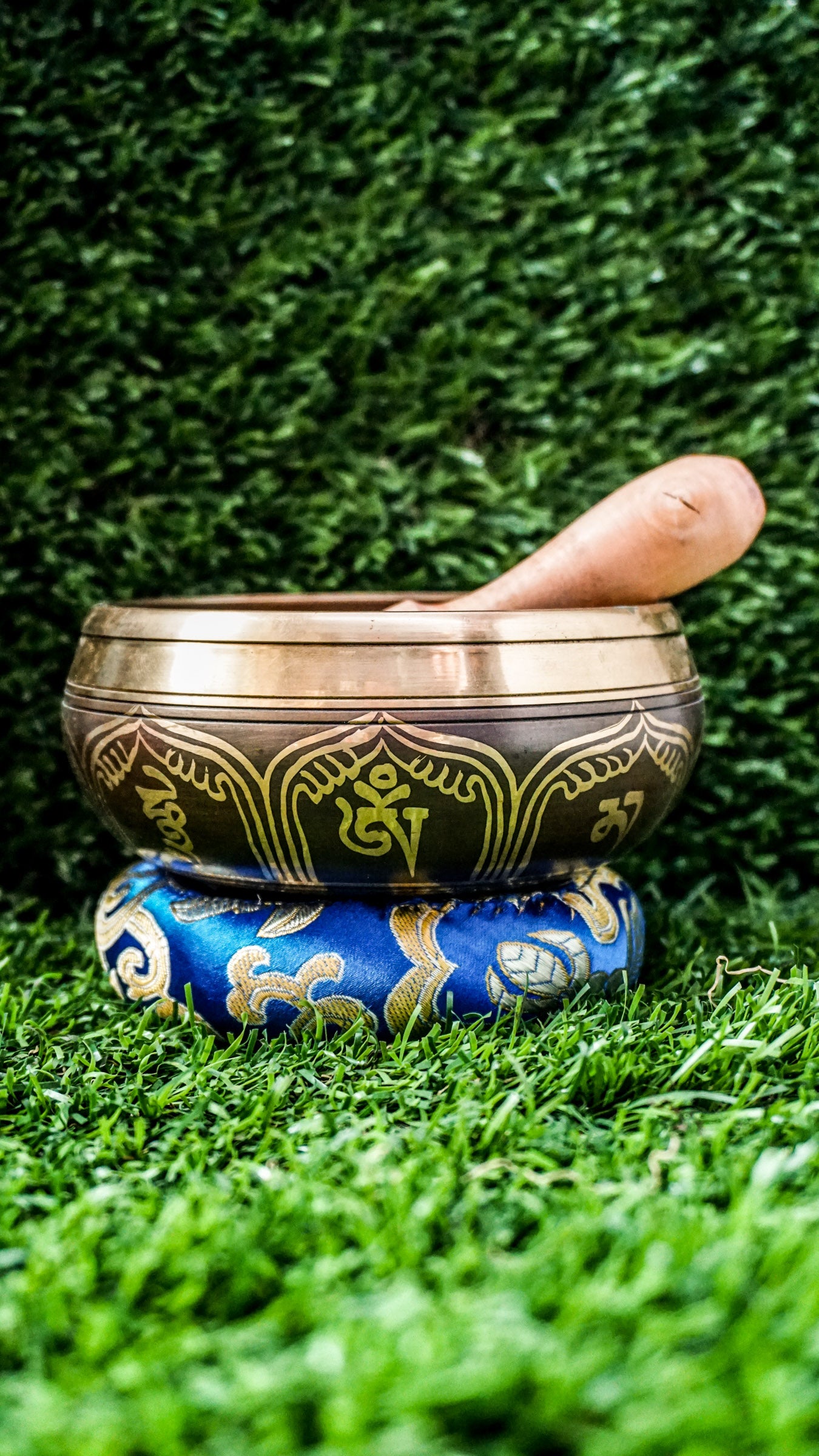 
This singing bowl has the Om Mani Padme Hum mantra carved inside on a mandala and around the outside. Its clear, steady tone supports meditation and calm. Comes with a wooden mallet and silk cushion. Wipe gently and store in a dry place.