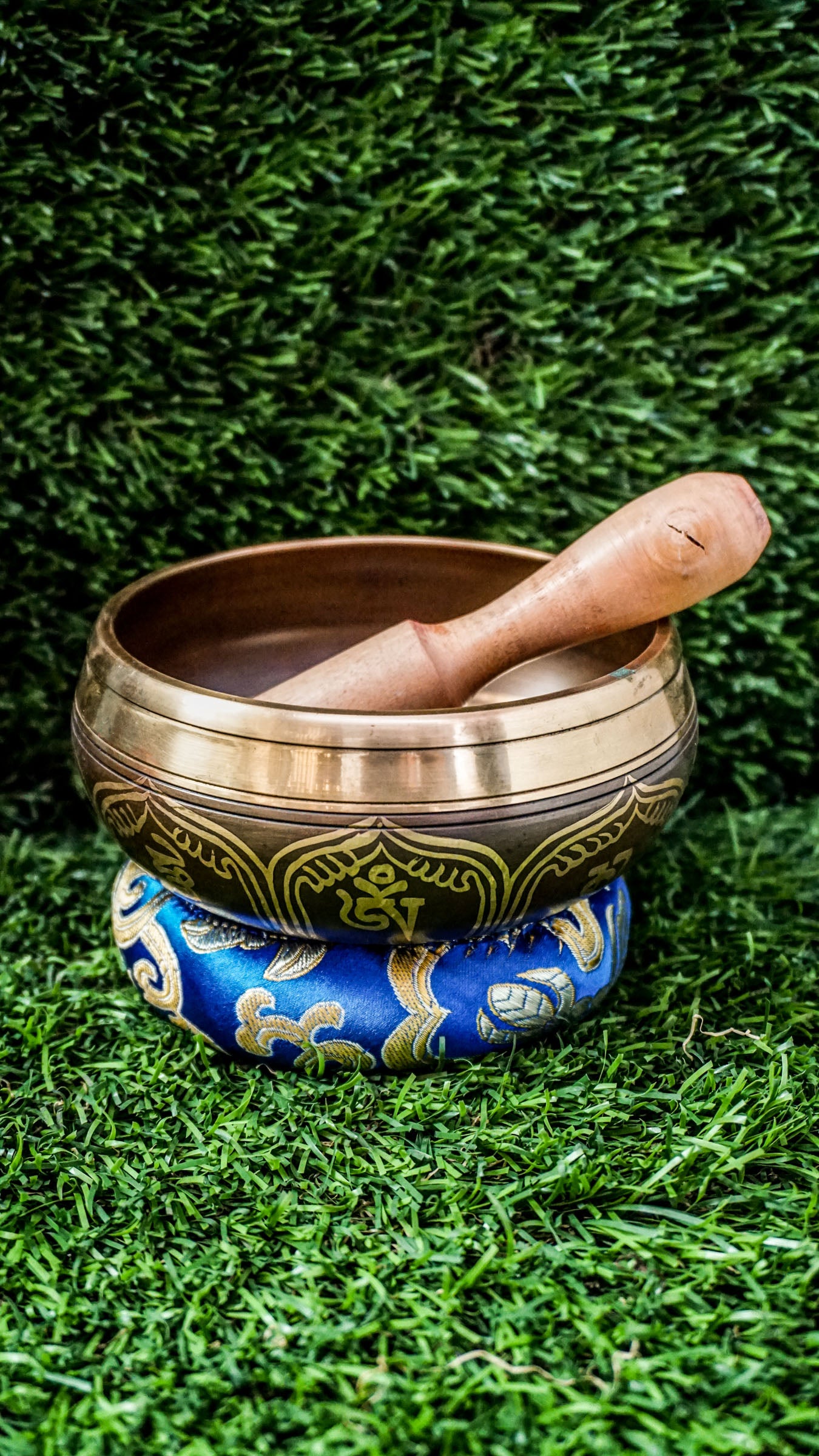 
This singing bowl has the Om Mani Padme Hum mantra carved inside on a mandala and around the outside. Its clear, steady tone supports meditation and calm. Comes with a wooden mallet and silk cushion. Wipe gently and store in a dry place.