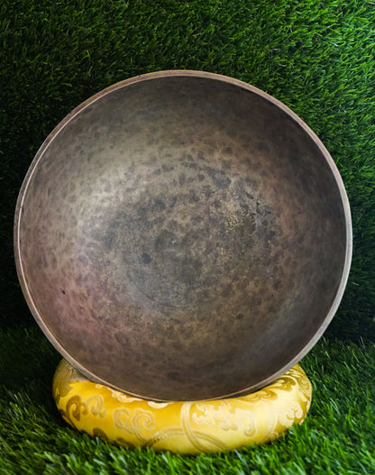Semi-antique peacock carved singing bowl handcrafted in Nepal with detailed peacock motifs for meditation and healing.
