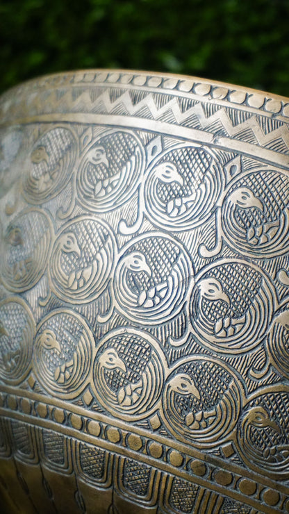 Semi-antique peacock carved singing bowl handcrafted in Nepal with detailed peacock motifs for meditation and healing.