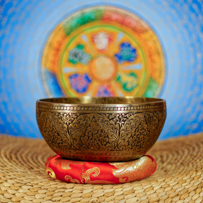 Semi antique Tibetan singing bowl with intricate floral engraving, handcrafted in Nepal for meditation and sound practice
