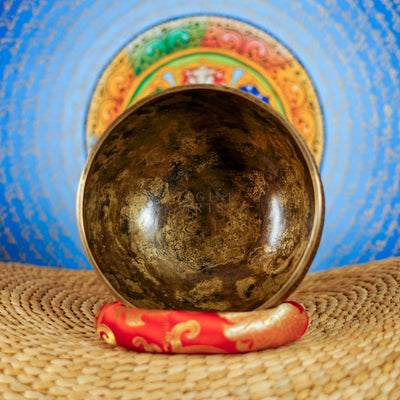 Semi antique Tibetan singing bowl with intricate floral engraving, handcrafted in Nepal for meditation and sound practice