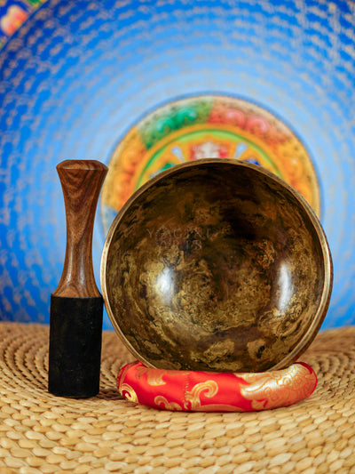 Semi antique Tibetan singing bowl with intricate floral engraving, handcrafted in Nepal for meditation and sound practice