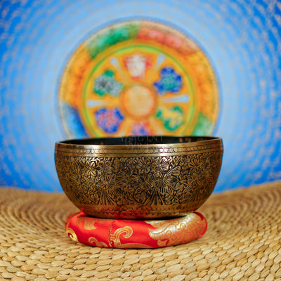 Semi antique Tibetan singing bowl with detailed floral and foliage engraving, handcrafted in Nepal