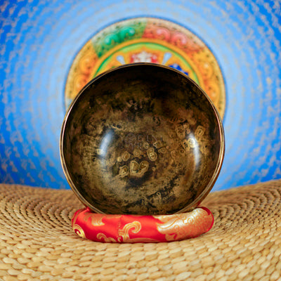 Semi antique Tibetan singing bowl with detailed floral and foliage engraving, handcrafted in Nepal