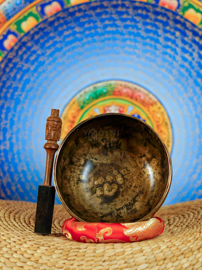 Semi antique Tibetan singing bowl with detailed floral and foliage engraving, handcrafted in Nepal