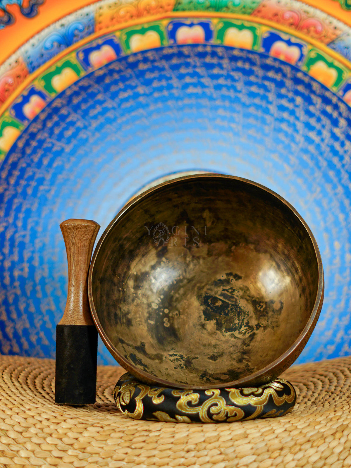 Semi antique floral engraved Tibetan singing bowl handcrafted in Nepal with detailed botanical patterns and antique bronze finish