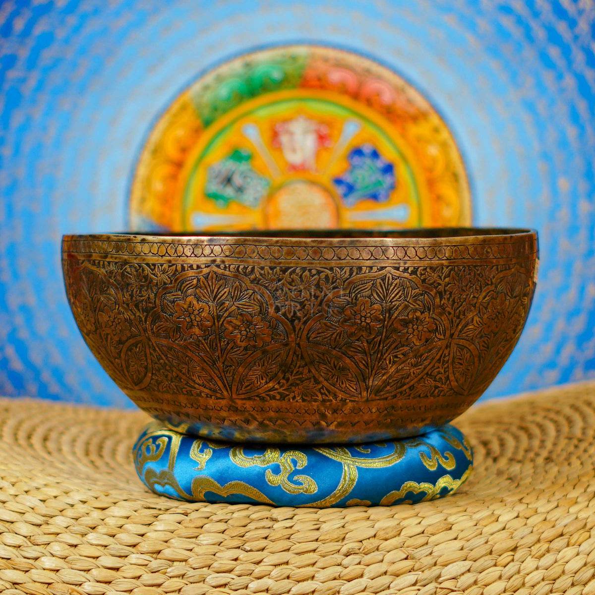 Semi antique floral engraved singing bowl handcrafted in Nepal with intricate flowers and leaf patterns in an antique bronze finish