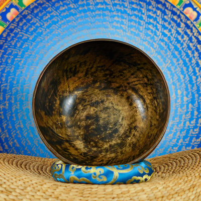 Semi antique floral engraved singing bowl handcrafted in Nepal with intricate flowers and leaf patterns in an antique bronze finish