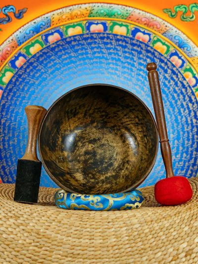 Semi antique floral engraved singing bowl handcrafted in Nepal with intricate flowers and leaf patterns in an antique bronze finish