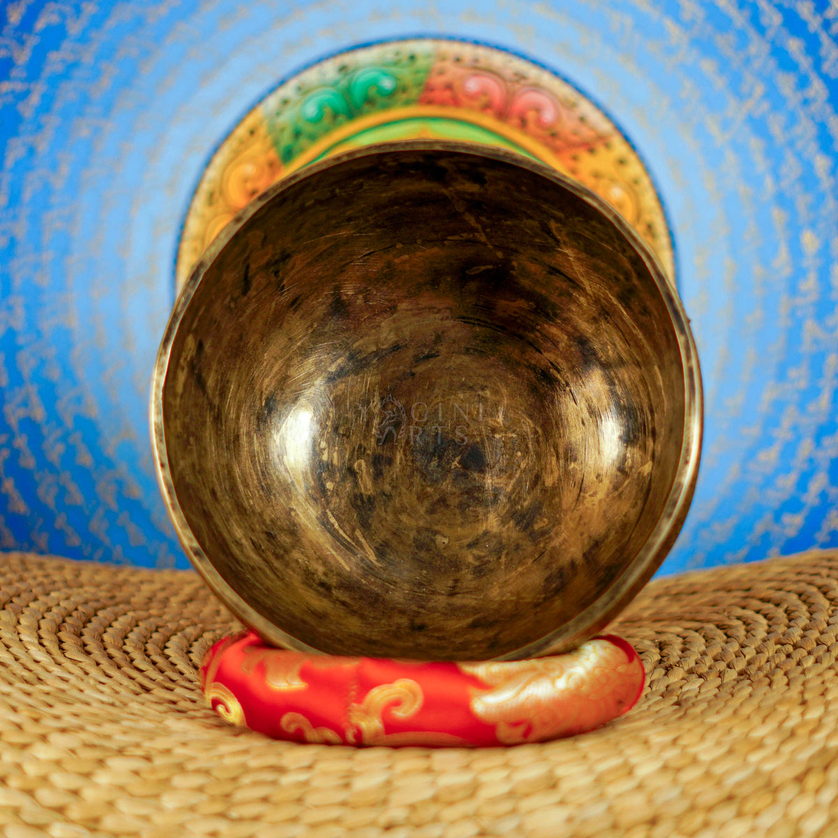 Semi antique floral engraved singing bowl handcrafted in Nepal with intricate flower and leaf patterns and an antique bronze finish