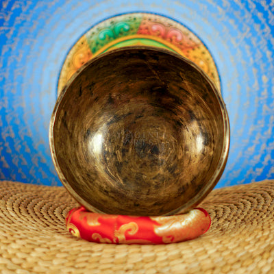 Semi antique floral engraved singing bowl handcrafted in Nepal with intricate flower and leaf patterns and an antique bronze finish