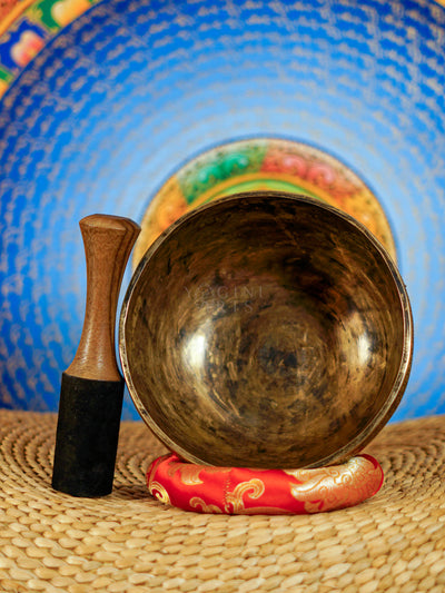 Semi antique floral engraved singing bowl handcrafted in Nepal with intricate flower and leaf patterns and an antique bronze finish