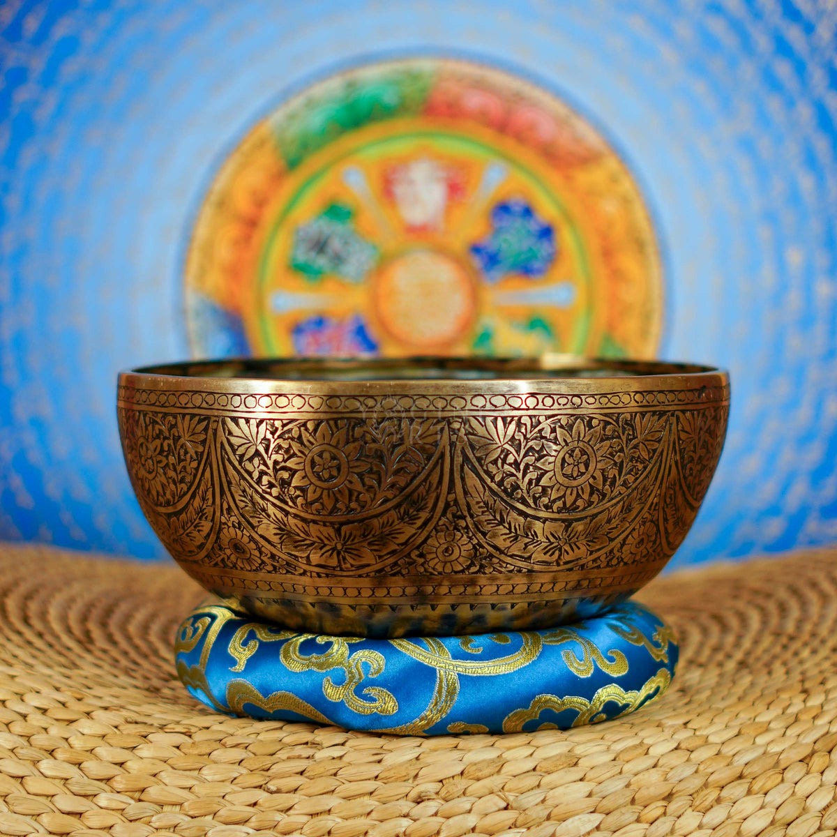 Semi antique singing bowl with intricate floral engraved panels and traditional aged bronze finish