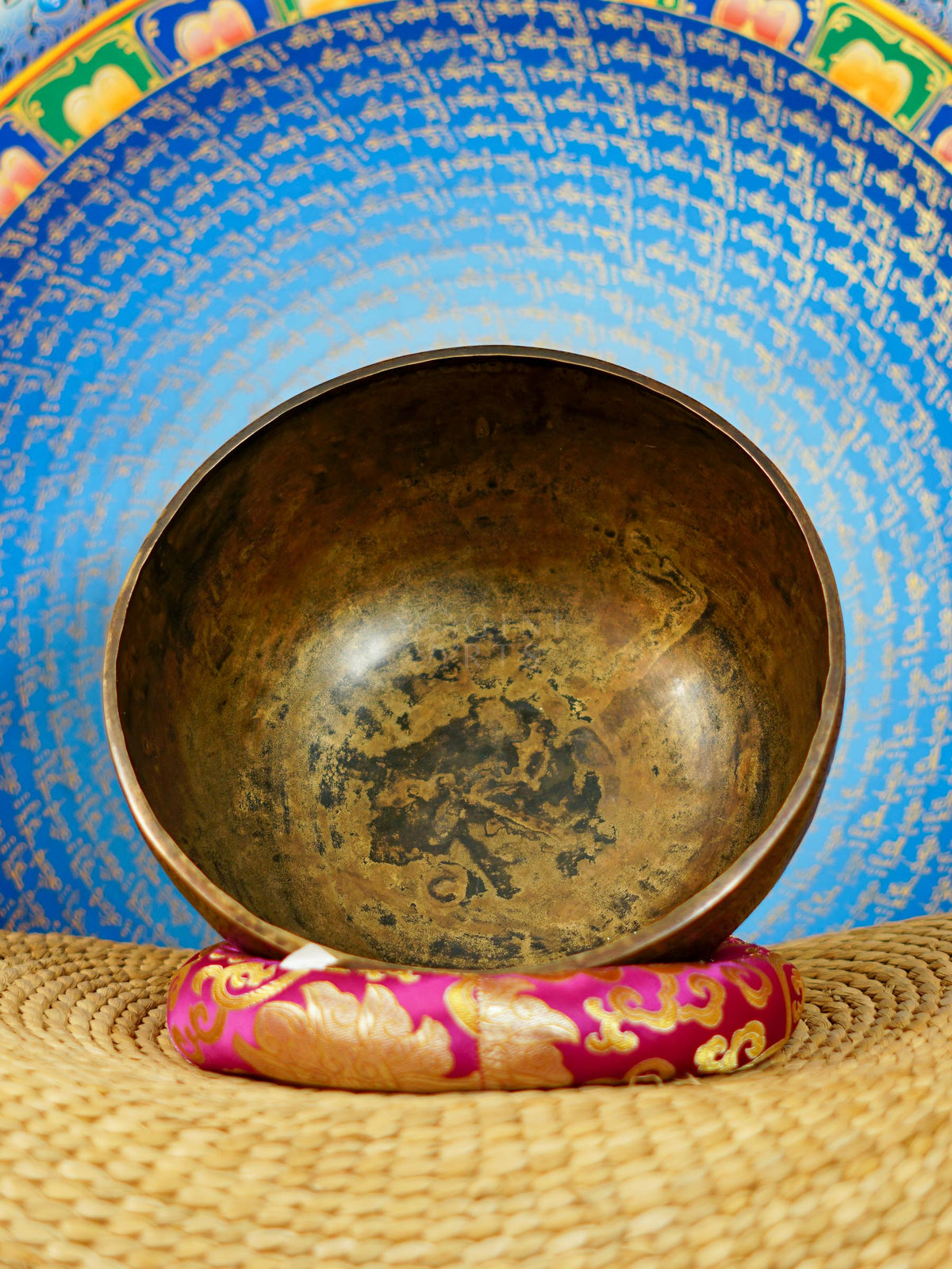 Semi antique singing bowl with intricate arch and floral engraved patterns in an aged bronze finish