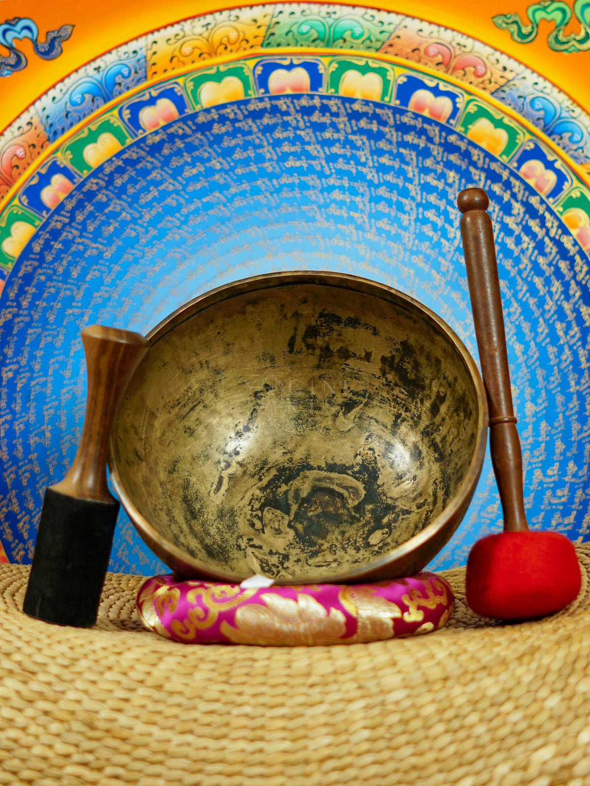 Semi antique singing bowl with intricate star-shaped floral engraving and traditional botanical patterns