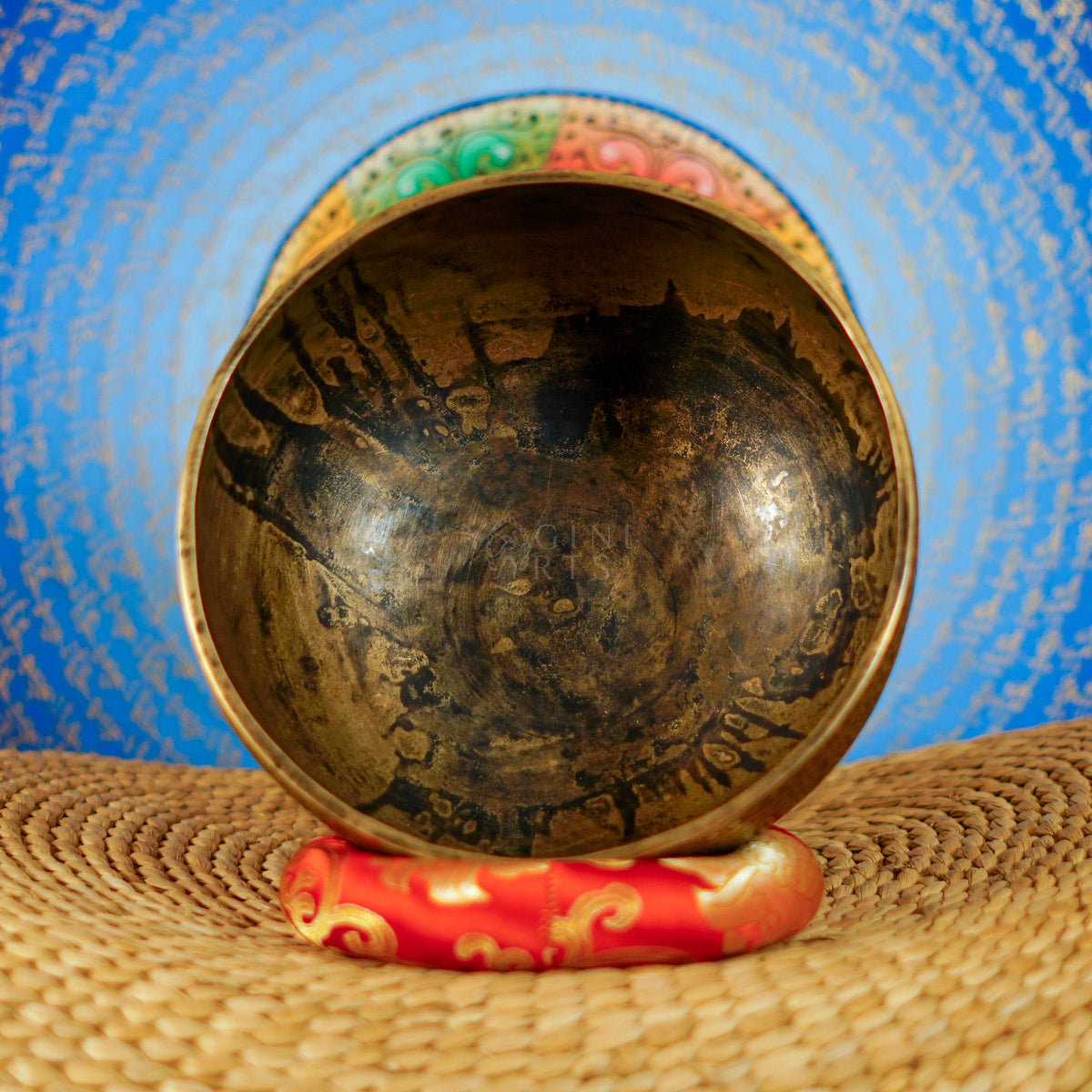 Semi antique singing bowl with circular floral and leaf engraving, traditional Himalayan design