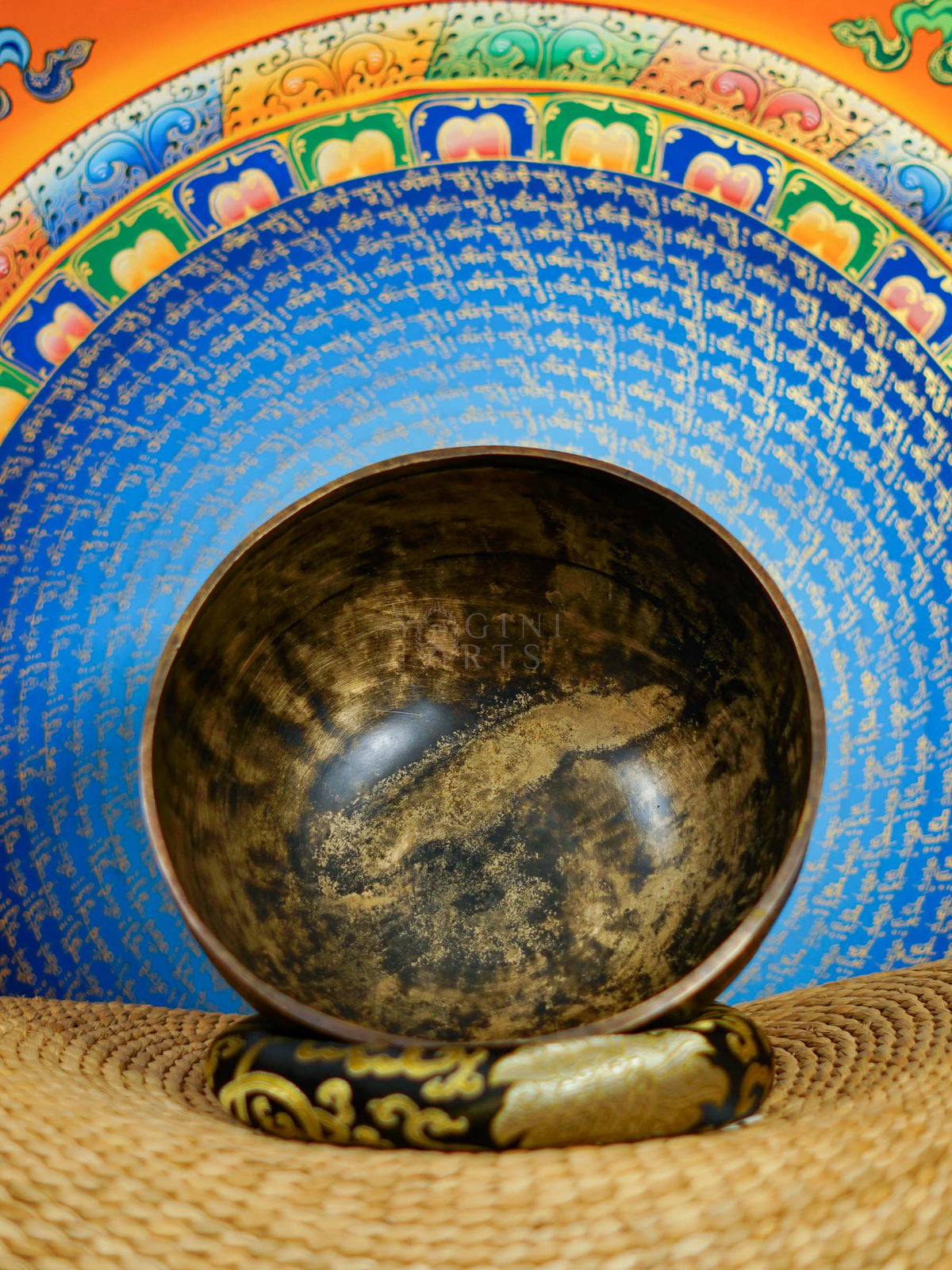 Semi antique singing bowl with intricate floral and leaf engraving, traditional Himalayan design