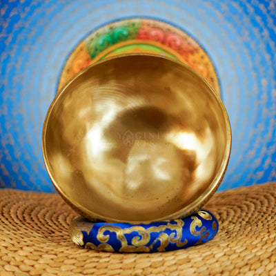 Semi antique singing bowl with hand-engraved bird and floral patterns, traditional Himalayan design