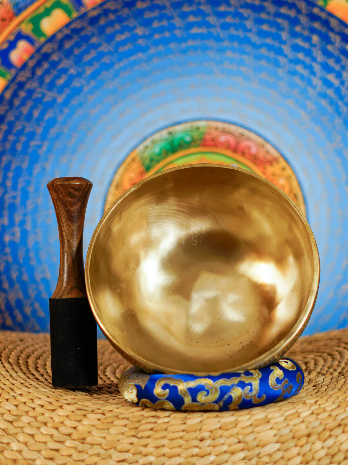Semi antique singing bowl with hand-engraved bird and floral patterns, traditional Himalayan design