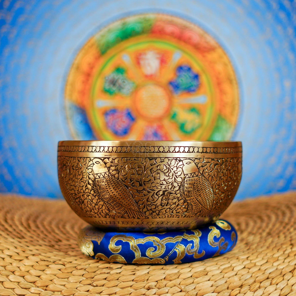 Semi antique singing bowl with engraved bird and floral design, handcrafted in Nepal