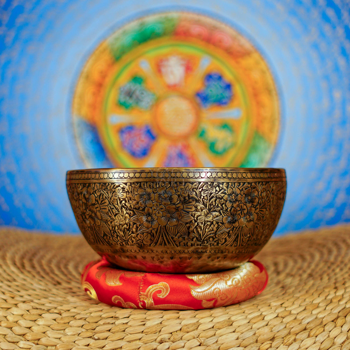 Semi antique handmade singing bowl with intricate floral engravings and aged bronze finish from Nepal