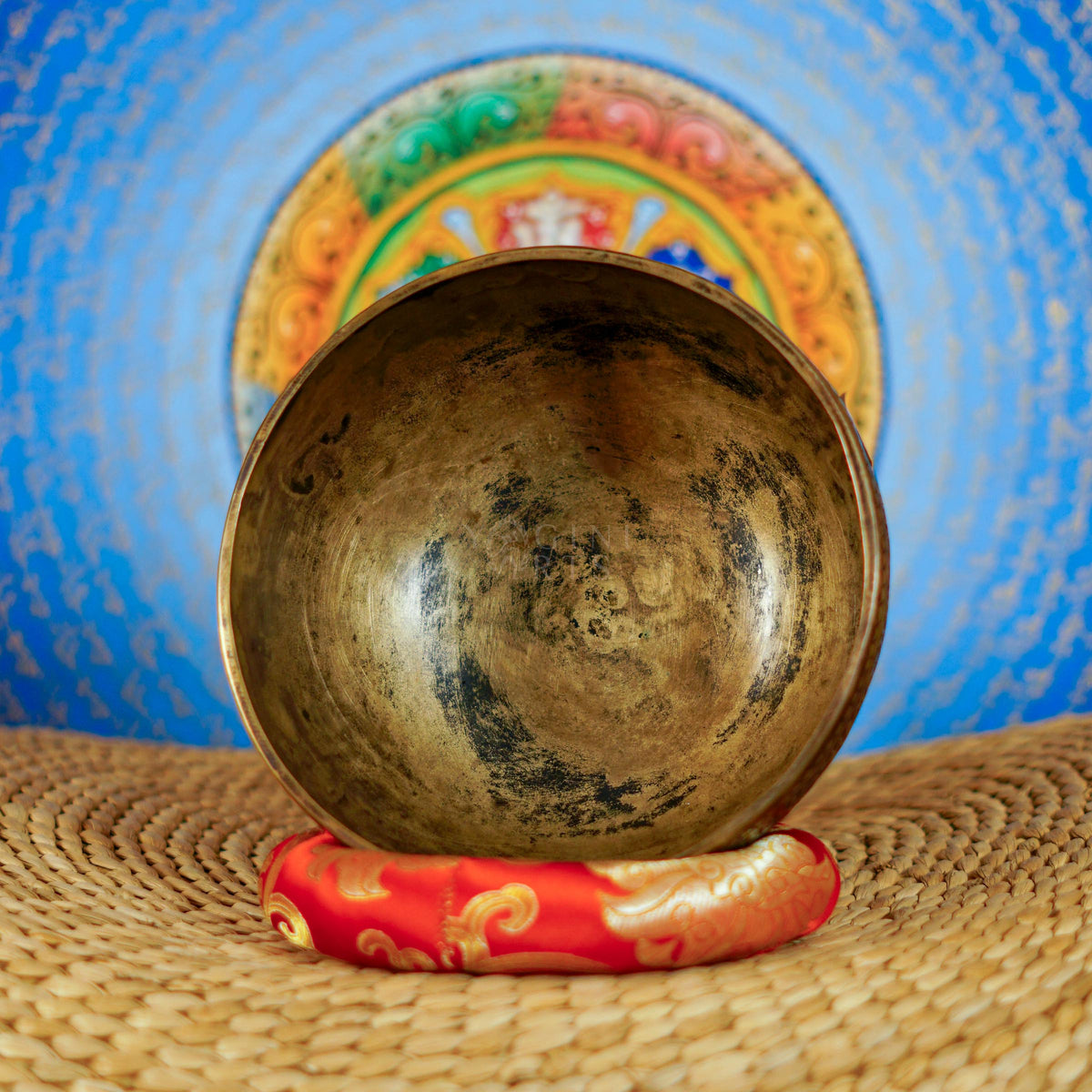 Semi antique handmade singing bowl with intricate floral engravings and aged bronze finish from Nepal