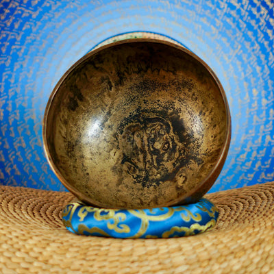Semi antique handmade singing bowl with intricate geometric floral and leaf engraving on aged bronze metal