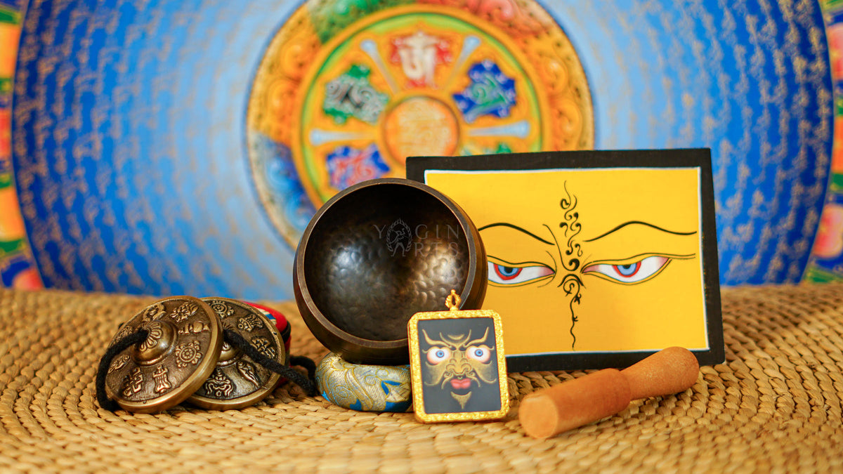 Buddhist ritual set from Nepal featuring singing bowl, Ashtamangala tingsha, wooden mallet, bell, vajra and meditation accessories
