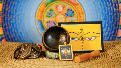 Buddhist ritual set from Nepal featuring singing bowl, Ashtamangala tingsha, wooden mallet, bell, vajra and meditation accessories