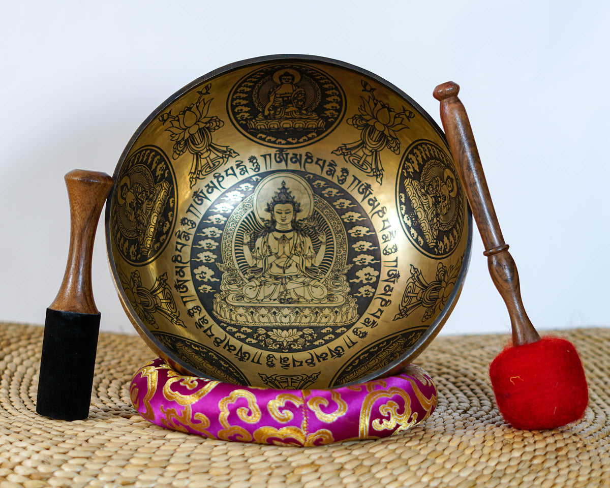 Interior view of Chengresi singing bowl featuring an engraved Bodhisattva, lotus throne, Tibetan mantras, and traditional Buddhist motifs