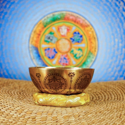 Chakra Mandala singing bowl with sacred geometry, meditation figure, and detailed engraved Buddhist-inspired artwork