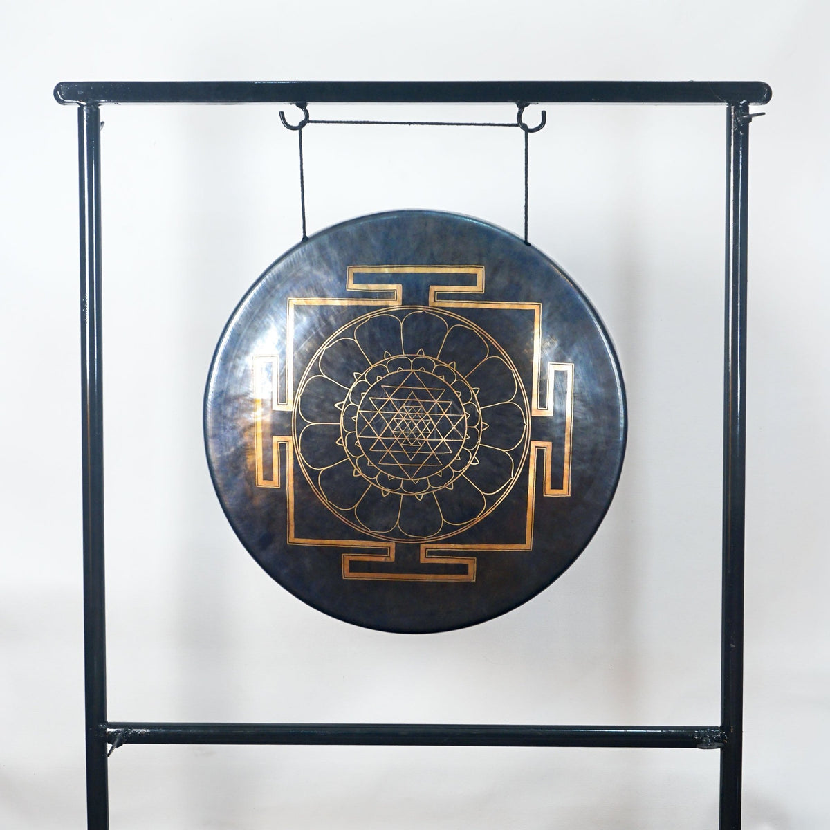 Front view of a Tibetan-style meditation gong featuring a gold sacred geometry mandala with lotus petals and four geometric gateways.