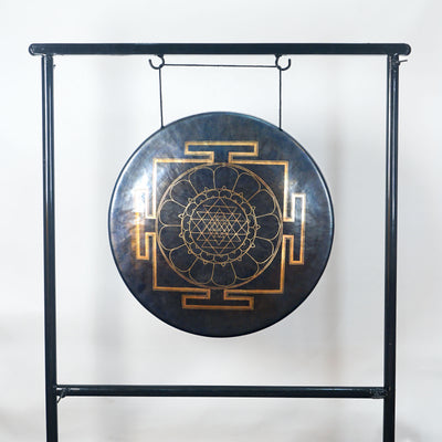 Front view of a Tibetan-style meditation gong featuring a gold sacred geometry mandala with lotus petals and four geometric gateways.
