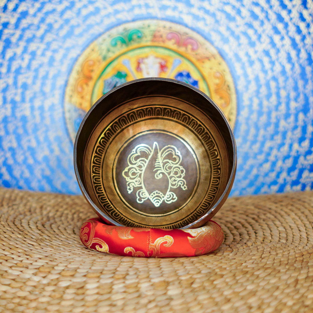 Conch singing bowl with traditional Buddhist conch symbolism and detailed engraved Nepalese craftsmanship