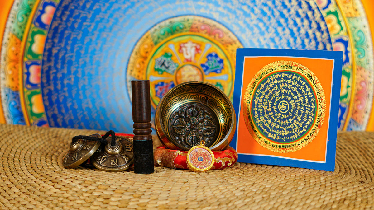 Dorje Singing Bowl Set with traditional Tibetan tingsha, suede mallet, decorative cushion, and Buddhist artwork from Nepal