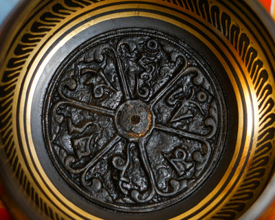 Close-up of sacred mantra design inside a handcrafted Himalayan singing bowl