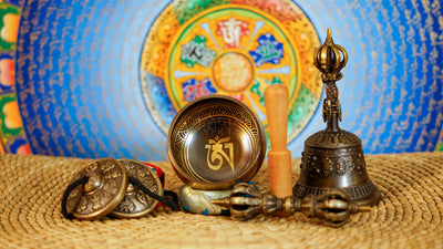 Mantra singing bowl meditation set with Ashtamangala tingsha, wooden mallet, cushion and Buddhist accessories from Nepal