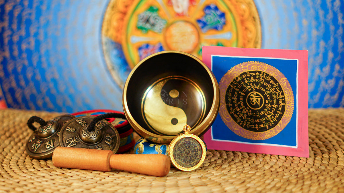 Yin Yang singing bowl meditation set with Ashtamangala tingsha, wooden mallet, cushion and Buddhist devotional accessories from Nepal