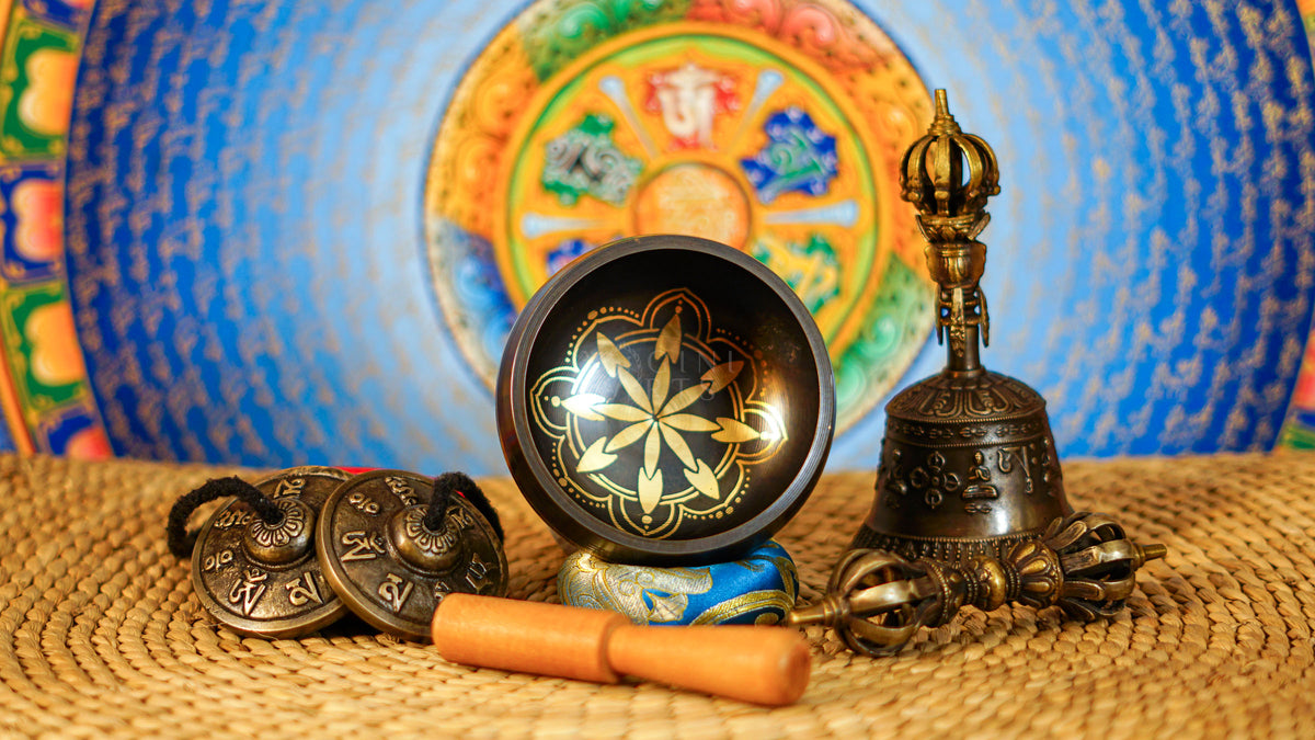 Complete ornate lotus singing bowl ritual set with Ashtamangala tingsha, Buddhist bell, vajra, wooden mallet and meditation accessories from Nepal