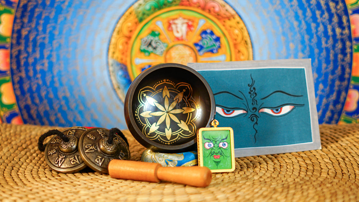Ornate lotus singing bowl meditation set with Ashtamangala tingsha, wooden mallet, cushion and Buddhist devotional accessories from Nepal