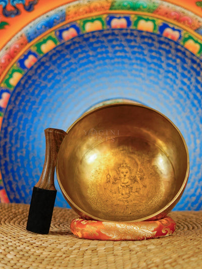 Interior of Chengresi singing bowl showing detailed engraved Buddhist artwork