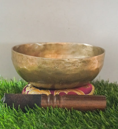 Semi-antique Singing Bowl handcrafted in Nepal with aged patina, producing deep resonant tones for meditation and healing.