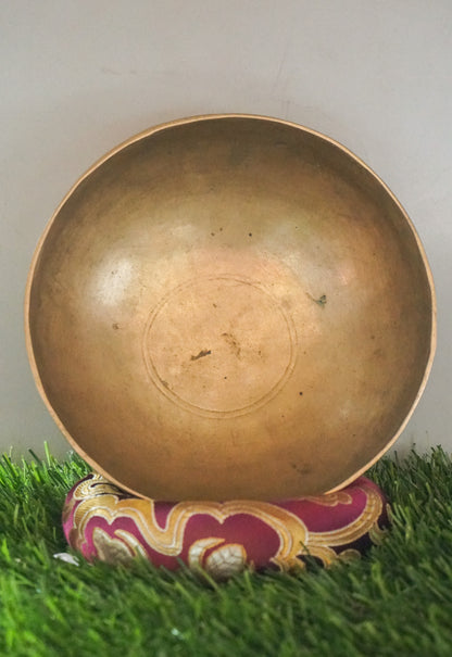Semi-antique Singing Bowl handcrafted in Nepal with aged patina, producing deep resonant tones for meditation and healing.