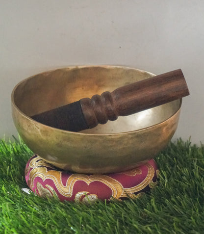 Semi-antique Singing Bowl handcrafted in Nepal with aged patina, producing deep resonant tones for meditation and healing.