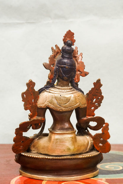 White Tara statue, a symbol of healing, compassion. With seven all-seeing eyes and serene lotus posture, she brings peaceful energy and protection.