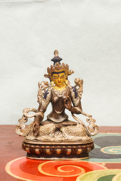 The silver-covered White Tara statue, she sits in serene lotus posture with seven eyes symbolizing watchful wisdom. A radiant symbol of peace and longevity, meditation, or as a meaningful spiritual gift.