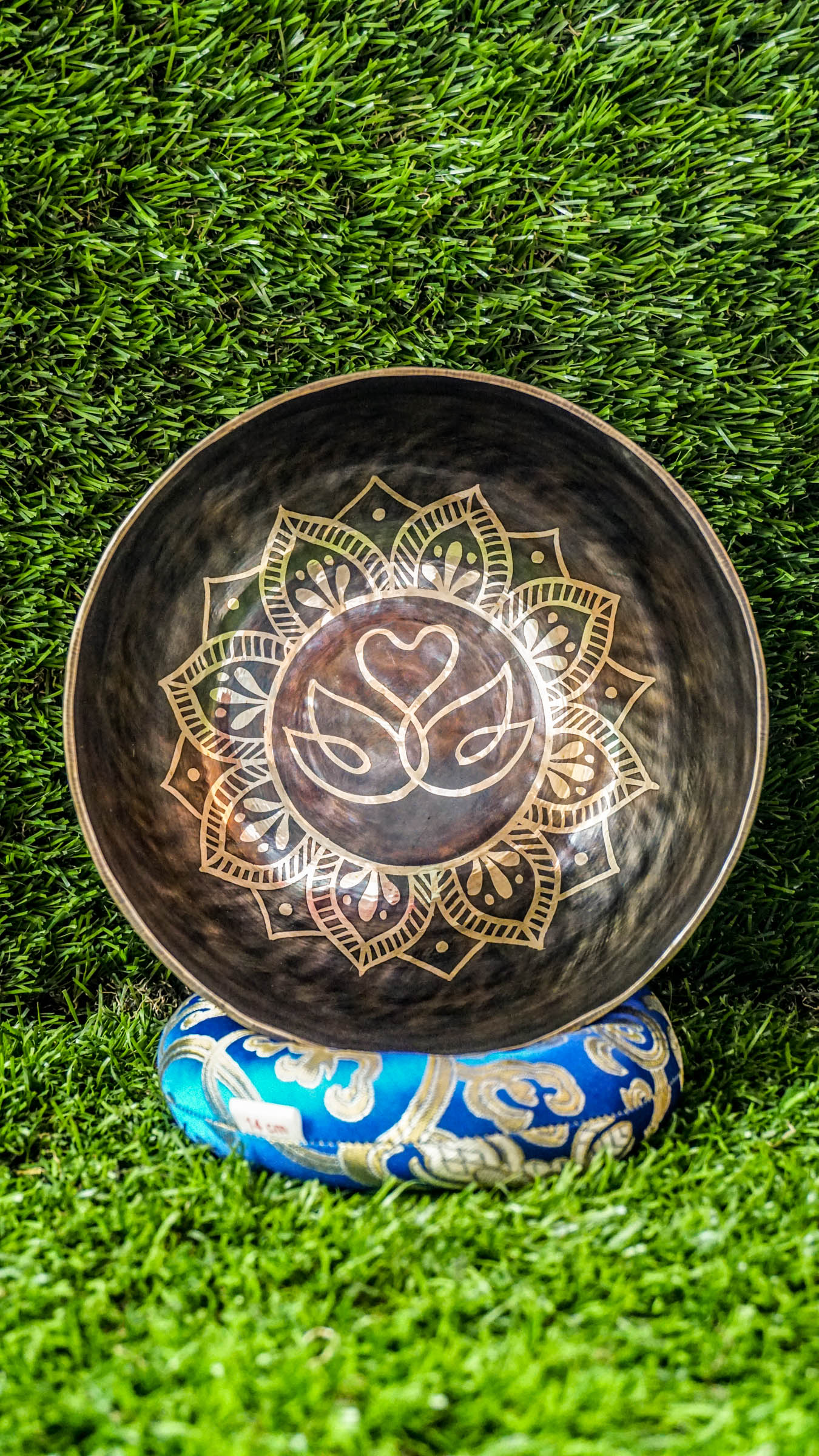 The Swan Singing Bowl features two swans forming a heart within a flower mandala, symbolizing love, unity, and peace. Matching mandala patterns wrap around the bowl, adding beauty and balance. Its soothing sound creates a calming atmosphere perfect for meditation, reflection, or daily relaxation.
