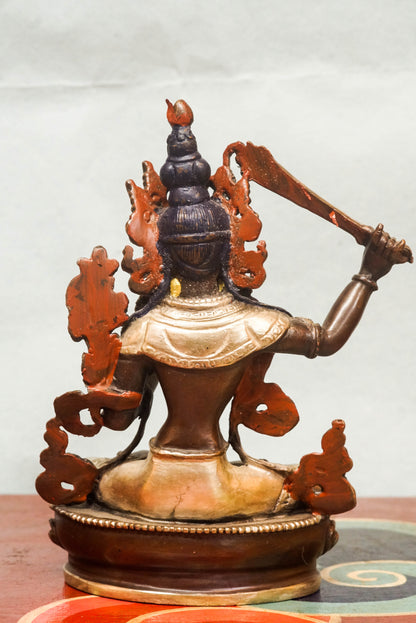 Manjushri statue is known as the Bodhisattva of Wisdom, Manjushri holds a flaming sword to cut through ignorance and a lotus supporting sacred scriptures. It is perfect for meditation spaces, study areas, or altars, it inspires insight, spiritual growth, and intellectual awakening.